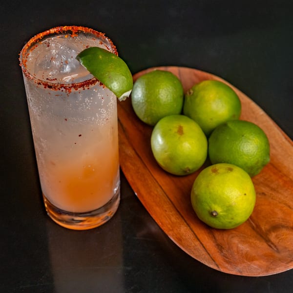 Fuentes Cafe Downtown's refreshing Mexican drink with a chili-lime rim and a side of fresh limes.