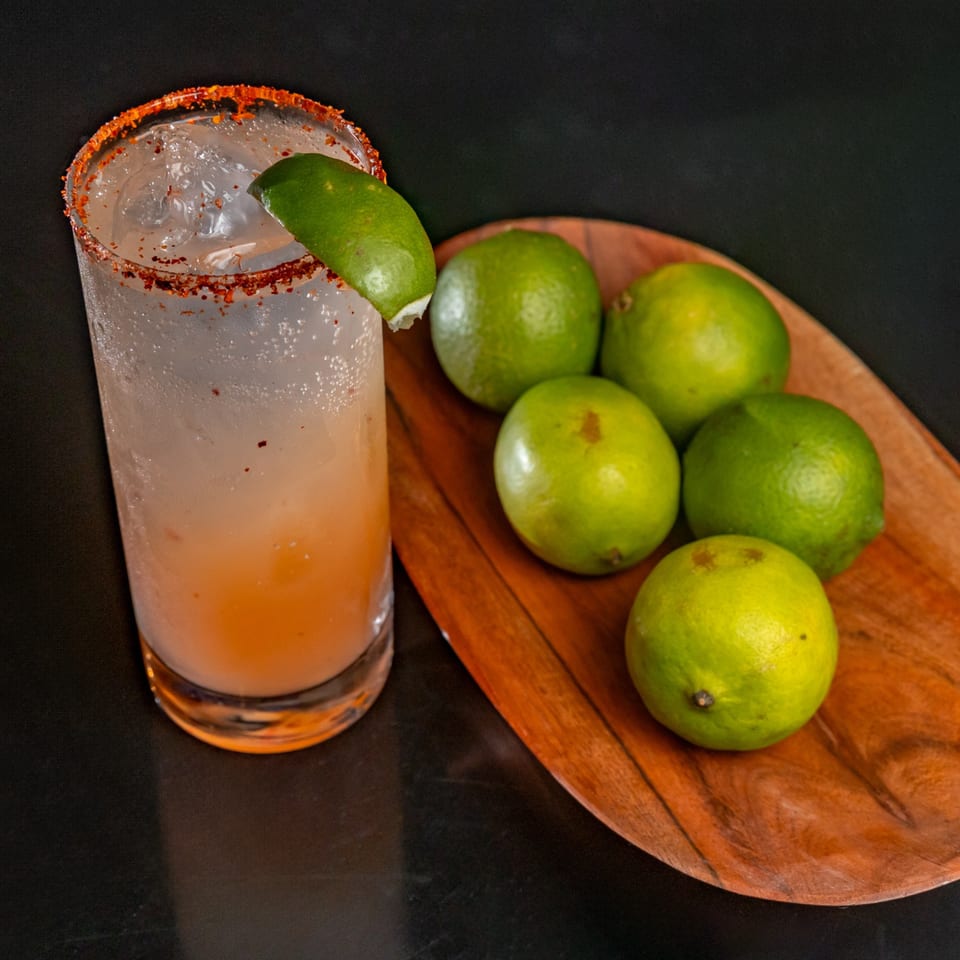 Fuentes Cafe Downtown's refreshing Mexican drink with a chili-lime rim and a side of fresh limes.